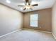 This bedroom features neutral walls and carpet, and a window at 15069 Sw 29Th Avenue Rd, Ocala, FL 34473