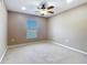 Comfortable bedroom featuring a ceiling fan and a bright window at 15069 Sw 29Th Avenue Rd, Ocala, FL 34473