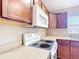 A well-lit kitchen shows modern appliances and wood cabinets, offering ample storage space at 15069 Sw 29Th Avenue Rd, Ocala, FL 34473