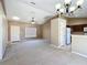 Open-concept living room featuring vaulted ceilings, a ceiling fan, and a view of the kitchen at 15069 Sw 29Th Avenue Rd, Ocala, FL 34473