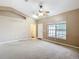 Open living room with vaulted ceiling, ceiling fan and a large window for natural light at 15069 Sw 29Th Avenue Rd, Ocala, FL 34473