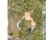 This aerial shows the roof shape and the circular driveway of this home at 1590 Twelve Oaks Cir, Kissimmee, FL 34744