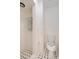 Bathroom featuring white tile walls, a toilet and a walk-in shower at 1590 Twelve Oaks Cir, Kissimmee, FL 34744