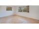 Bedroom featuring two windows providing ample natural light at 1590 Twelve Oaks Cir, Kissimmee, FL 34744