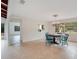 Dining area with charming chandelier and a view into the back yard at 1590 Twelve Oaks Cir, Kissimmee, FL 34744