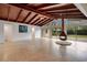 Spacious living room featuring a wood ceiling, modern fireplace, and sliding glass doors to the outdoors at 1590 Twelve Oaks Cir, Kissimmee, FL 34744