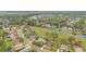 Aerial view of a neighborhood featuring lush landscaping, ponds, and winding streets at 1686 Shadowmoss Cir, Lake Mary, FL 32746