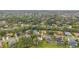 Panoramic aerial view showcasing a residential neighborhood with tree-lined streets and well-maintained houses at 1686 Shadowmoss Cir, Lake Mary, FL 32746
