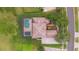 Overhead aerial shot showing tile roof, in-ground screened pool, and manicured lawn at 1686 Shadowmoss Cir, Lake Mary, FL 32746