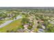 Panoramic aerial view of a beautiful neighborhood with lush greenery and a serene lake at 1686 Shadowmoss Cir, Lake Mary, FL 32746