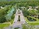 Aerial view of the neighborhood entrance, with beautiful ponds and fountains in a scenic community setting at 1686 Shadowmoss Cir, Lake Mary, FL 32746