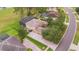 Aerial view showcasing a luxury home with a brick driveway and a screened-in pool area at 1686 Shadowmoss Cir, Lake Mary, FL 32746