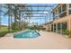 A large enclosed pool and backyard, with lots of natural light and patio space at 1686 Shadowmoss Cir, Lake Mary, FL 32746