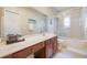 Bathroom featuring a shower, bathtub, and vanity at 1686 Shadowmoss Cir, Lake Mary, FL 32746