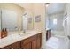 Bathroom featuring a shower, bath tub, and wood vanity at 1686 Shadowmoss Cir, Lake Mary, FL 32746