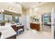 Primary bathroom featuring a vanity, makeup station, and walk-in shower, seamlessly connected to the main bedroom at 1686 Shadowmoss Cir, Lake Mary, FL 32746