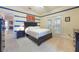 Bedroom with French doors, neutral walls with blue accent lines, and closet at 1686 Shadowmoss Cir, Lake Mary, FL 32746