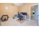 Spare bedroom with an ergonomic gaming setup and neutral carpet flooring, ready for customization at 1686 Shadowmoss Cir, Lake Mary, FL 32746
