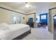 Bedroom featuring a ceiling fan, TV, and desk, creating a versatile space at 1686 Shadowmoss Cir, Lake Mary, FL 32746