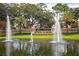 Magnolia Plantation entrance with beautiful fountains, lush landscaping, and a welcoming ambiance for residents and visitors at 1686 Shadowmoss Cir, Lake Mary, FL 32746