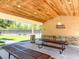 The Magnolia Plantation community pavilion, with picnic tables and a relaxing space near the tennis courts at 1686 Shadowmoss Cir, Lake Mary, FL 32746
