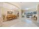 Elegant dining area featuring a chandelier, tray ceilings, and an adjacent living area at 1686 Shadowmoss Cir, Lake Mary, FL 32746