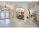 Grand foyer with tile floors, arched doorways, and a view of the formal dining room at 1686 Shadowmoss Cir, Lake Mary, FL 32746