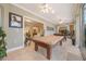 Light and bright game room with pool table, and is open to the rest of the home at 1686 Shadowmoss Cir, Lake Mary, FL 32746