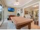 Game room includes a pool table, recessed lighting, and is open to the living room with neutral paint at 1686 Shadowmoss Cir, Lake Mary, FL 32746