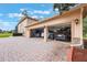 Spacious three-car garage featuring a beautiful brick driveway and ample space for vehicles and storage at 1686 Shadowmoss Cir, Lake Mary, FL 32746