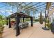 Covered gazebo with comfortable seating area next to pool at 1686 Shadowmoss Cir, Lake Mary, FL 32746