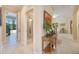 Hallway featuring tile flooring and a view into the bathroom and living room at 1686 Shadowmoss Cir, Lake Mary, FL 32746