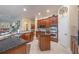 Gourmet kitchen with granite counters, wood cabinets, stainless steel appliances, and large island at 1686 Shadowmoss Cir, Lake Mary, FL 32746