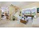 Bright and airy living room with staircase, fireplace, and pool table view at 1686 Shadowmoss Cir, Lake Mary, FL 32746