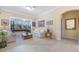 Cozy living room with plush seating and large windows overlooking the backyard at 1686 Shadowmoss Cir, Lake Mary, FL 32746