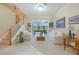 Bright and airy living room with staircase, fireplace, and pool table at 1686 Shadowmoss Cir, Lake Mary, FL 32746