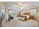 Spacious main bedroom features tray ceilings, plantation shutters, and private bath at 1686 Shadowmoss Cir, Lake Mary, FL 32746