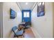 Functional home office space with ample natural light and practical furnishings set against vibrant blue accent wall at 1686 Shadowmoss Cir, Lake Mary, FL 32746