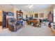 Large home office featuring comfortable seating, ample desk space, and practical storage, all bathed in natural light at 1686 Shadowmoss Cir, Lake Mary, FL 32746
