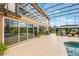 A large outdoor patio with enclosed pool and gazebo at 1686 Shadowmoss Cir, Lake Mary, FL 32746