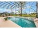 A beautiful enclosed pool with an attached spa and gazebo in backyard at 1686 Shadowmoss Cir, Lake Mary, FL 32746