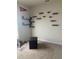 Versatile bedroom space with minimalist shelving, neutral tones, and carpeted floors at 1707 Ambar Ct, Winter Haven, FL 33881