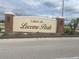 Attractive community entrance sign for Lakes at Lucerne Park, set amongst landscaped grounds at 1707 Ambar Ct, Winter Haven, FL 33881