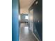 Hallway leading into the living room featuring neutral paint and tile floors at 1707 Ambar Ct, Winter Haven, FL 33881
