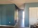 Hallway with ceramic tile flooring and neutral paint leading to the front entrance at 1707 Ambar Ct, Winter Haven, FL 33881