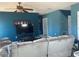 Living room featuring comfortable seating, neutral paint, and a ceiling fan at 1707 Ambar Ct, Winter Haven, FL 33881