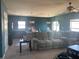 Open-concept living room with view of the kitchen, comfortable seating, and a ceiling fan at 1707 Ambar Ct, Winter Haven, FL 33881