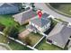 Aerial view of property highlighting the backyard, brick patio, and proximity to neighboring homes at 2020 Windcrest Lake Cir, Orlando, FL 32824