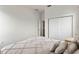 Bedroom featuring a sliding door closet and an adjoining doorway at 2020 Windcrest Lake Cir, Orlando, FL 32824