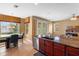 Bright kitchen area featuring granite countertops, an island with bar seating, and stainless steel appliances at 2020 Windcrest Lake Cir, Orlando, FL 32824